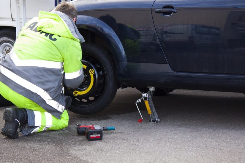 Man changing a flat tire