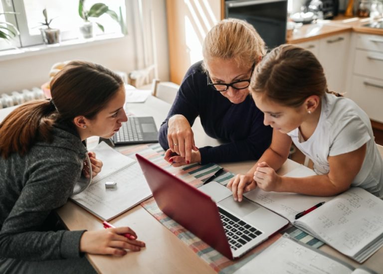 Family looking at laptop computer