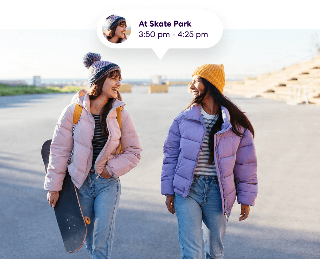 Two young women with skateboards and Life360 notification "At Skate Park"