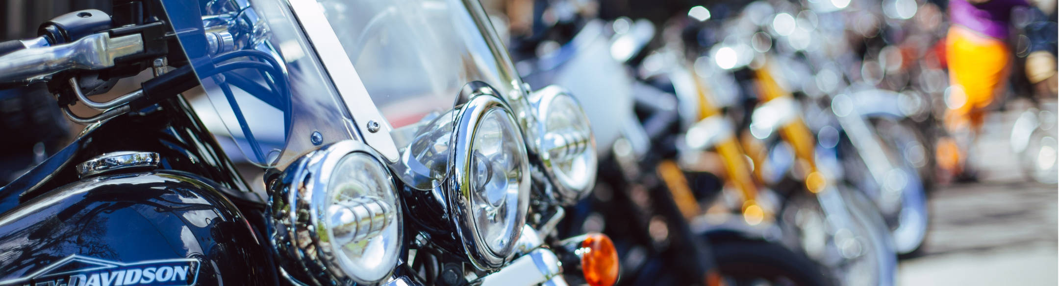 Line of motorcycles parked at the curb