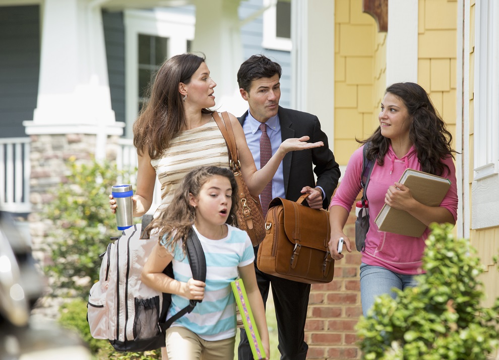 Family of four heading out of the house in the morning