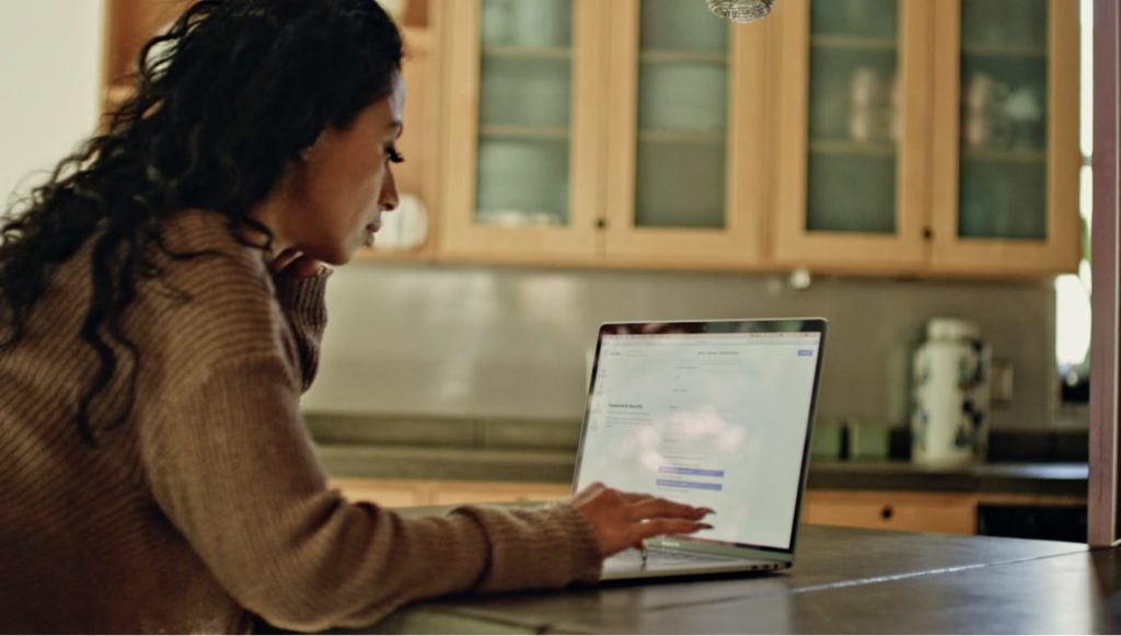 Woman looking at laptop