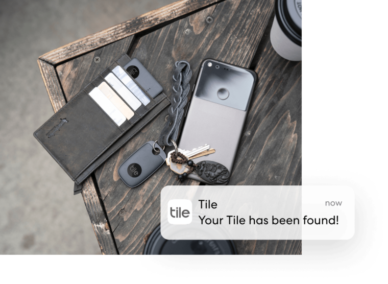 Tile on keys and wallet with Tile 'Your Tile has been found’ notification